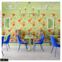 Café interior featuring citrus slice wallpaper from the Summer Citrus Mediterranean Market Collection by Lisette Niemand, with orange, lime and lemon motifs in a vibrant repeat.