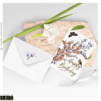 Stationery 3 Birthday card design by Lisette Niemand featuring Charming Chintz, shown in a stationery mock-up with envelope. Features delicate trailing florals, birds, and butterflies in autumnal tones with “Happy Birthday” typography.