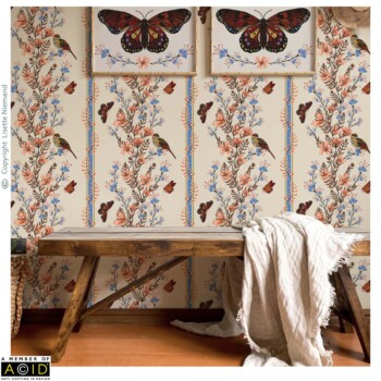 WallPaper Designs 3 Wallpaper design by Lisette Niemand called Charming Chintz, shown in a hallway or mudroom interior mock-up. Features trailing floral stems with birds and butterflies arranged in vertical panels with decorative stripe borders in autumnal tones of mustard gold, red, blue, and peach.