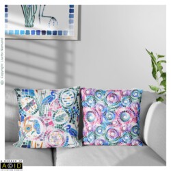 Living room sofa with coordinated cushions featuring the Kaleidoscope Pond Life hero pattern and Kaleidoscope Mosaic design by Lisette Niemand.